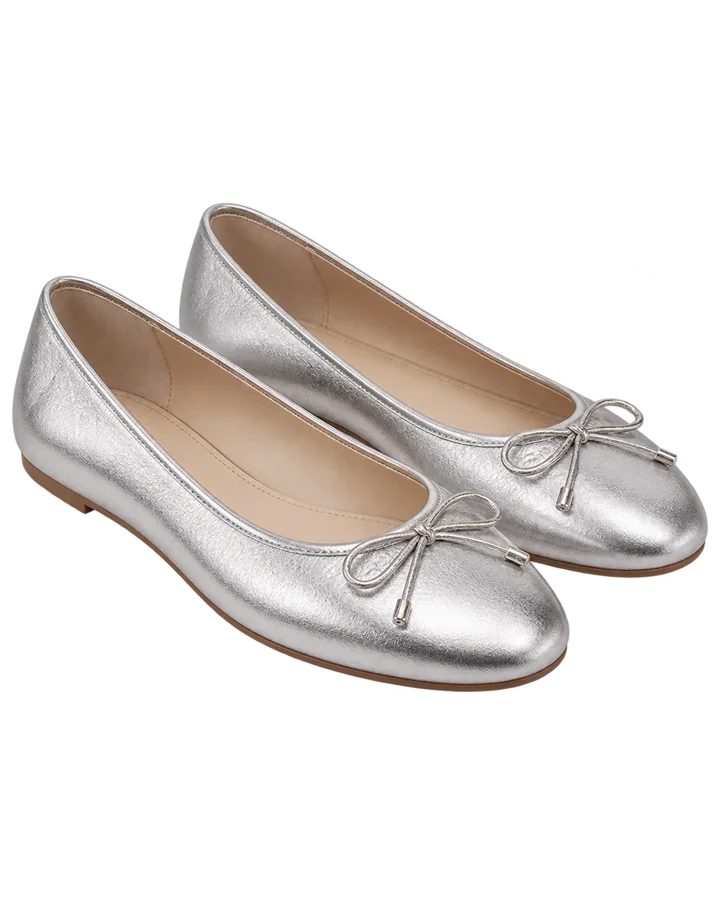 Silver ballet flats being photographed on a phone